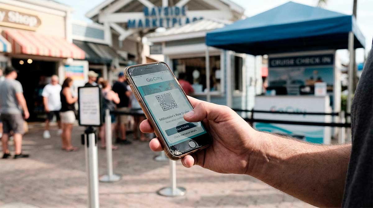 Using the Go City Miami app at Bayside Marketplace to audit actual attraction savings.
