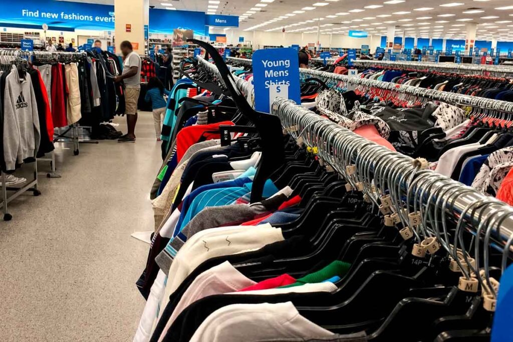 Rows of shirts and clothing racks inside a Miami off-price store