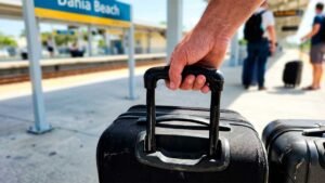 Evaluating the real cost and logistics of using South Florida rail transit from FLL to Miami with heavy luggage.
