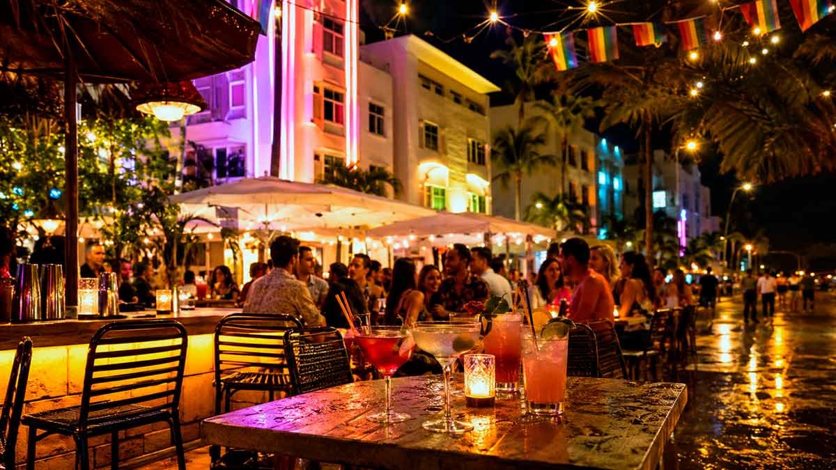 Outdoor bar scene on Ocean Drive at night, representing the real cost and experience of gay nightlife in Miami beyond the Instagram version.